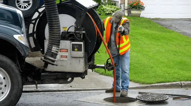 Technician using specialized drainage equipment for sewer line cleaning and foundation protection in Green Bay, WI